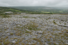 Karst pavements and topography of the Burren approx 5km south of Ballyvaughan Co Clare Ireland. Exposures of the Dinantian Burren Limestone Formation are composed of shallow water carbonates. Note the clints (limestone blocks) and grikes (joints formed by Variscan folding (Coller, 1984) and fracturing) enlarged by Pleistocene disolution (Williams, 1966).